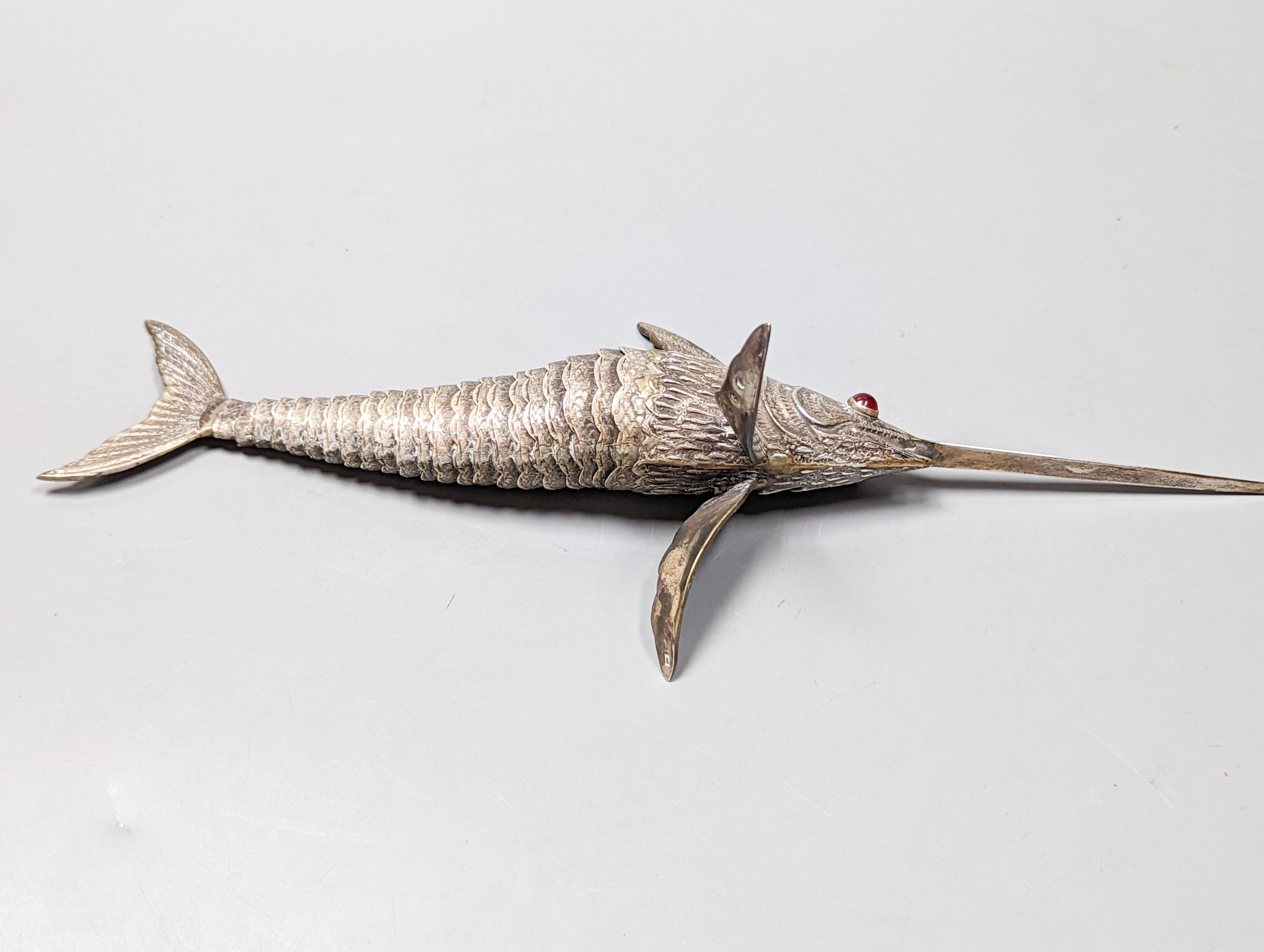 A 20th century Spanish articulated model of a swordfish, with red glass eyes, approx. 26.5cm, gross weight 118 grams.